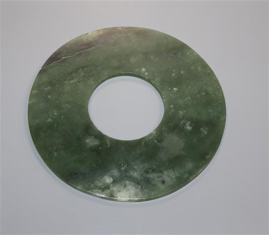 A Chinese spinach green jade bi disc 15.4cm